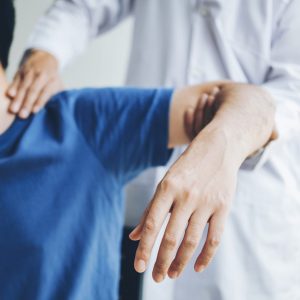Physical Doctor consulting with patient
